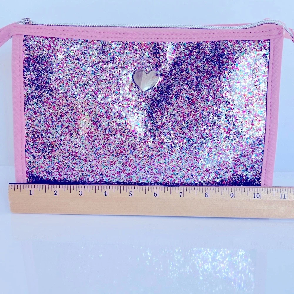 Pink Glitter Cosmetic Bag with a Silver Heart on Clear Vinyl & a Silver Zipper.